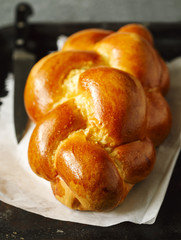 Freshly baked sweet braided bread loaf.  Challah bread