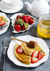 Crepes with berries and honey