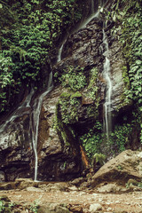 Waterfall hidden in the tropical jungle in Indonesia.