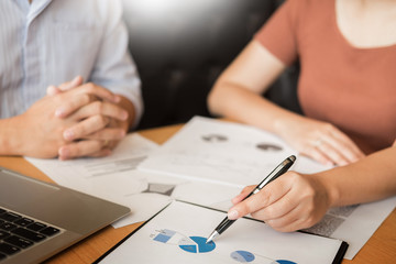 Team work process. young business managers crew working with new startup project. laptop on wood table, typing keyboard, texting message, analyze graph plans.