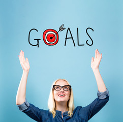 Goals with young woman reaching and looking upwards