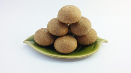 Dried Betel nuts or Areca nuts on bronze dish