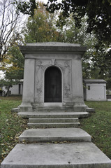 Fototapeta na wymiar Old Mausoleum in a Catholic Cemetery