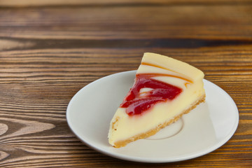 delicious cheesecake with strawberries on  plate