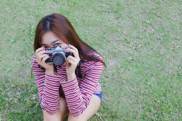 Fashion portrait of Hipster teen girl with old camera in