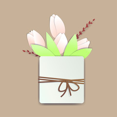 Square pot with tulip flowers and springs with a rope and a bow