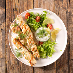 fried chicken with salad and sauce