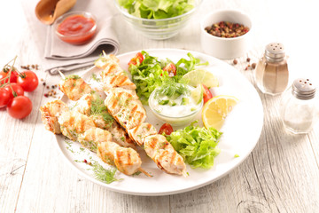 fried chicken with salad and sauce