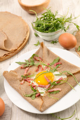 Fototapeta na wymiar buckwheat crepe with egg and bacon