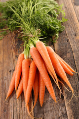 fresh carrot on wood background