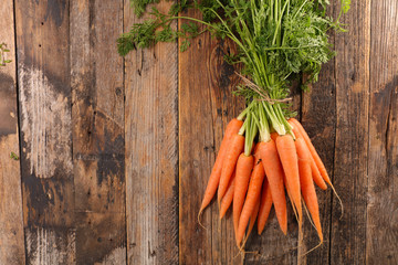 fresh carrot on wood background