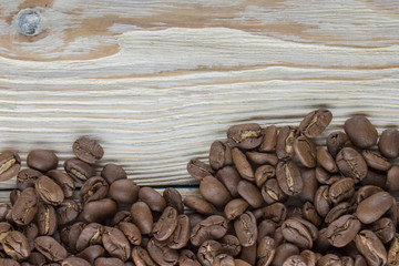 roasted coffee beans on wood texture