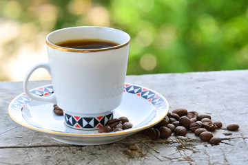 Cup of coffee on a wooden surface