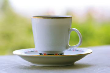 Cup of coffee on a wooden surface
