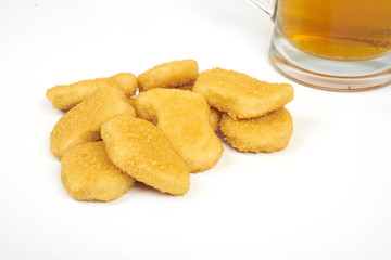 Chicken nuggets and beer isolated on white background