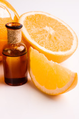 orange essential oil on a white background