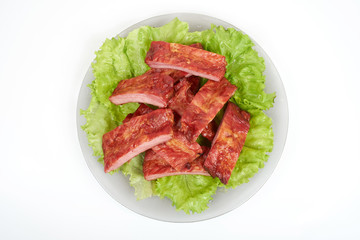 Close up grilled pork rib on the plate isolated on white background