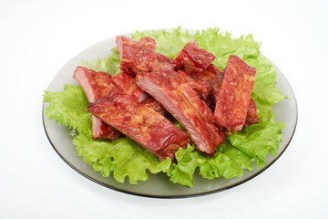Close up grilled pork rib on the plate isolated on white background