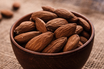 almond essential oil on a wooden background
