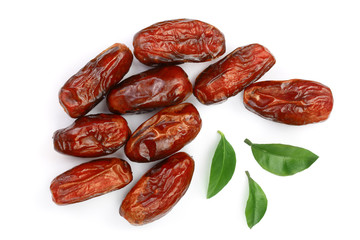 dry dates with green leaves isolated on white background. Top view. Flat lay pattern