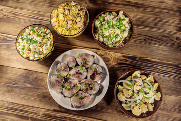 Various festive dishes on wooden table