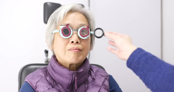 Senior Woman doing eye test