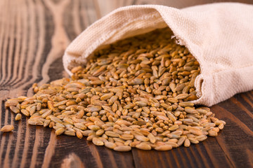 raw rye on wooden surface.