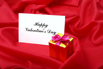 Valentine's day background with gift box and greeting card.