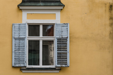 Old window with open shutters