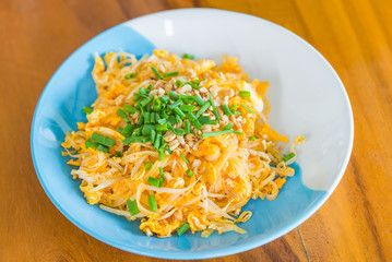 Thai food Pad thai , Stir fry is noodle food Thai traditional style (Thailand's national dishes) on wooden table.