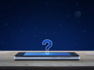 Question mark icon on modern smart phone screen on wooden table over fantasy night sky and moon,...