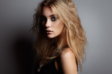 Obraz premium Portrait of young beautiful girl with blonde hair. Fashion photo Hairstyle. Make up. Vogue Style