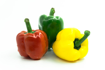 Three sweet peppers on white background