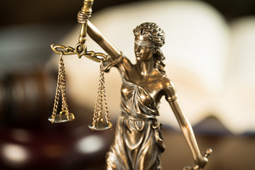 Law and Justice concept. Mallet of the judge, books, scales of justice.  Courtroom theme.