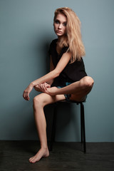 Naklejka premium Portrait of young beautiful girl with blonde hair. Fashion photo Hairstyle. Make up. Vogue Style.