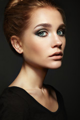 Fototapeta premium Portrait of young beautiful girl with blonde hair. Fashion photo Hairstyle. Make up. Vogue Style.