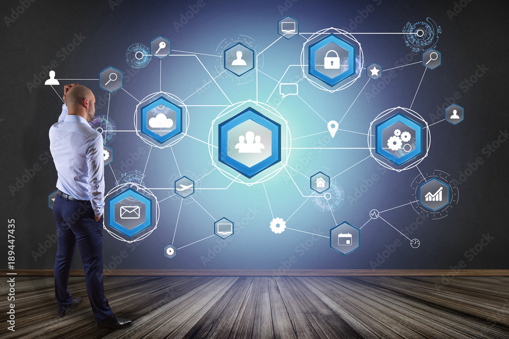 Poster businessman in front of a wall with an international business network connection displayed on a futu