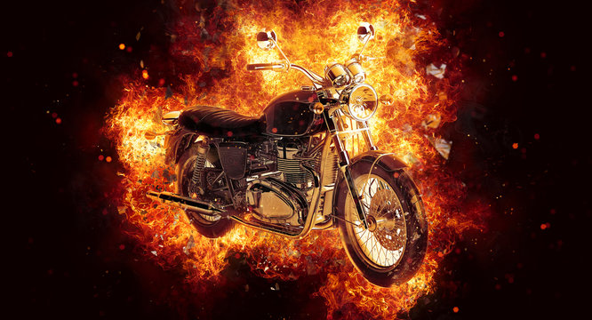 Dramatic burning motorcycle engulfed in flames