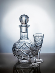 Crystal decanter and glasses on a light background