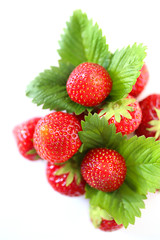 strawberry berry. ripe bright strawberry with green leaves isolated on white background