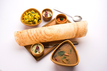 Masala dosa with chutney and sambar and potato sabzi. Cone, triangle or roll shape, selective...