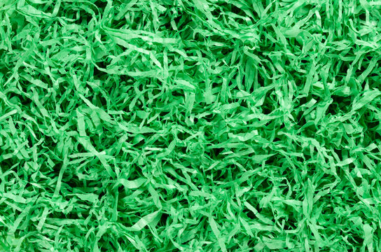 Green Paper Easter Grass Background From Above. Colored Crinkle Grass. Gift Basket Shred And Filler. Decoration.