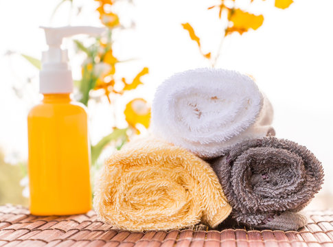 Spa Theme Collage Composed of Relaxing Oils and Towels