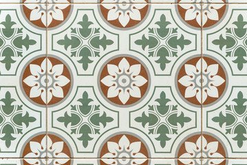 Seamless mosaic pattern with brown and green flower on a white background vintage style.