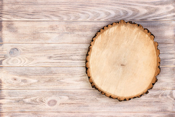 Wooden stump on a rustic wooden background