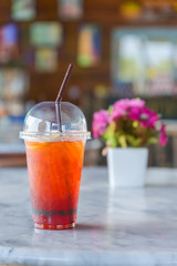 a glass of ice lemon tea in coffee shop vintage style Thailand