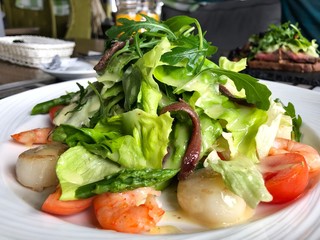 Salad of scallops  and shrimps with vegetables. Seafood salad