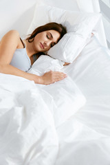 Fototapeta na wymiar Sleep. Young Woman Sleeping In Bed.