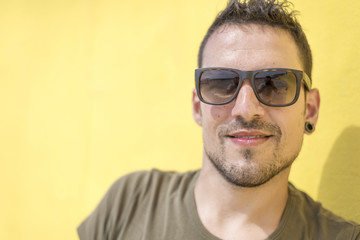 Colorful portrait of a handsome man dressed in green t-shirt