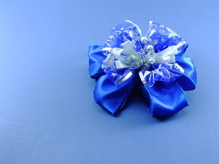 beautiful blue ribbon bow isolated on blue background